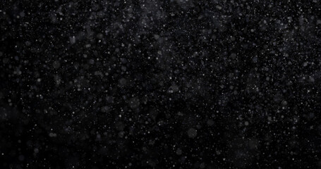 Wall Mural - Natural white winter snowfall on a black background 3d rendering