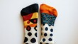© WINGGOD - 8. A pair of mismatched socks in contrasting colors and patterns on a white background