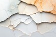 © c80 - Peeling paint on textured wall showcasing layers and cracks in varying colors and tones during daylight