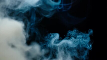 Poster - Mesmerizing blue smoke dances against black background. Ethereal wisps swirl and blend, creating hypnotic patterns. Abstract art in motion for atmospheric design projects 