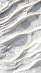 Poster - Soft white sea foam gently swirling and forming beautiful wavy patterns on the wet sand of a beach, creating a serene and textured backdrop that invites relaxation and tranquility