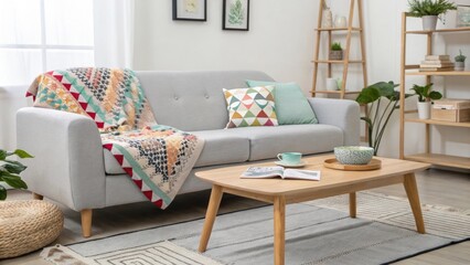 Poster - A contemporary living room embodying minimalism featuring a soft gray couch with a colorful patterned throw and a basic wooden coffee table as the focal point.
