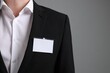 © New Africa - Man with blank badge on gray background, closeup. Space for text