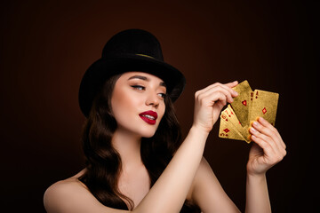 Wall Mural - Photo of rich attractive lady playing poker shuffle cards isolated on brown color background