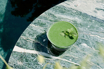 Wall Mural - verdant green smoothie with fresh mint sprigs