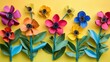 © Sinechana - 105.Collection of vibrant flower crafts created from toilet paper rolls, painted in bright colors, with green paper leaves, arranged in a playful scene for childrenâ€™s springtime DIY.