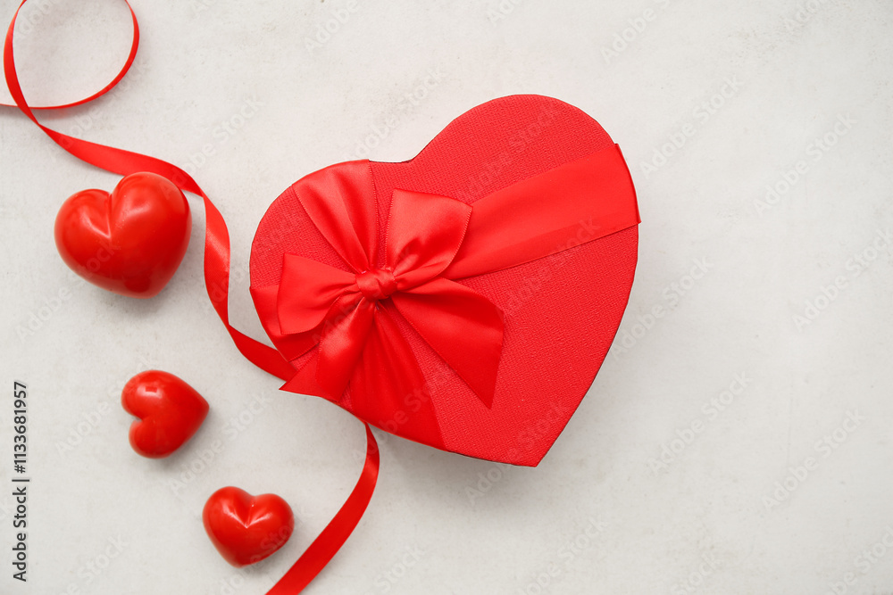 Gift box and hearts on white background. Valentine's Day celebration