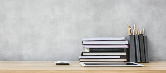 Aufkleber - Stack of books, tablet, mouse on wooden desk.