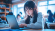© Ari - Japanese teenage girl studying in classroom using computer laptop