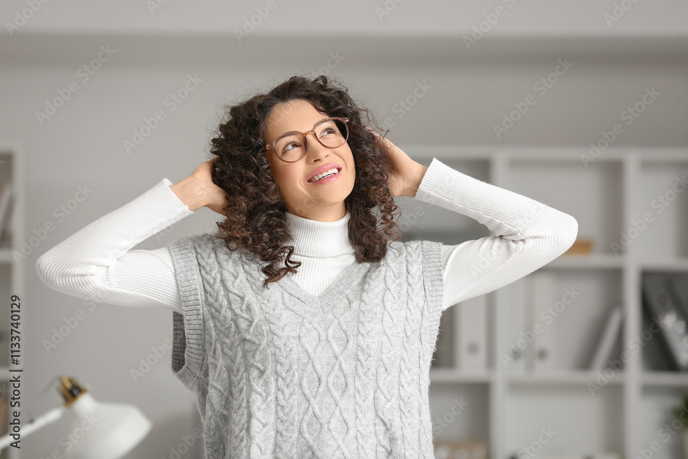 Young woman looking upwards in office