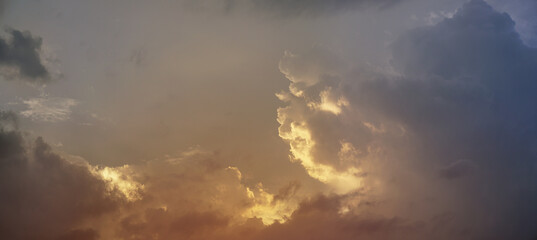Wall Mural - sunset sky with storm clouds and red sky at morning