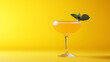 © mizan - First-class cocktail isolated on a yellow background