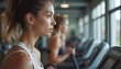 © AmberLand - Focused Woman Doing Cardio on Treadmill in Modern Gym