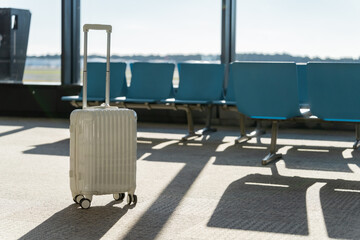 Fototapete - Travel, The suitcases in an empty airport hall, traveler cases in the departure airport terminal waiting for the area, vacation concept, blank space for text message or design, luggage for travel.