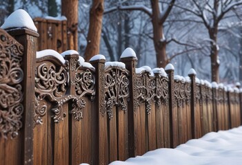 Canvas Print - Snow-covered wooden fence with intricate carvings , winter, wood, snow