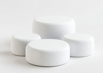 Poster - Four white textured cylindrical podiums on white background.