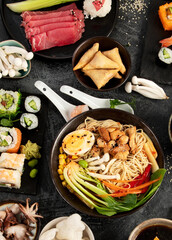 Wall Mural - Japanese dishes and snacks on gray background.