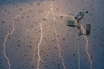 weather station automatic measurement of weather parameters with stormy sky and rain and lightning