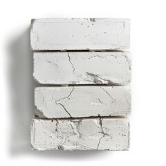 Poster - Stack of four white cinder blocks with visible cracks isolated on a white background, creating a simple yet textured composition