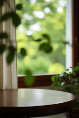 Poster - A wooden table sits atop a blur of curtains, its view obstructed by leaves from the nearby green garden trees._00002_