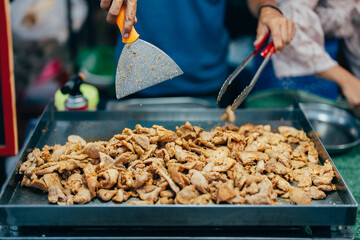 Wall Mural - Chef's fried pork menu is prominent in the Asian market as people are willing to pay more for a protein-free, chemical-free, nutritious product that is good for the body.