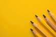 © Minerva Studio - Five sharpened pencils pointing upwards on vibrant yellow background