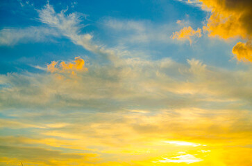 Wall Mural - Beautiful , luxury soft gradient orange gold clouds and sunlight on the blue sky perfect for the background, take in everning,Twilight, Large size, high definition landscape photo