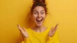 © Kanika Graphic - Joyful Woman Expressing Excitement Against Bright Yellow Background