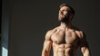 © familymedia - A fit man is bathed in sunlight, showcasing his chiseled upper body with defined abs and serious expression, embodying athleticism and strength in a serene setting.