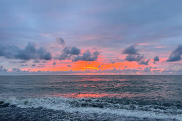 Wall Mural - beautiful red sky with clouds and sea