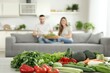© YURIMA - Couple enjoying healthy meal prep with fresh vegetables at home for a balanced diet and weight loss goals
