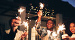© peopleimages.com - Outdoor, night and happy as friends with sparklers for new year and festive season celebration. Dark, people and excited or fun for gathering with fireworks for special occasion, event and festival