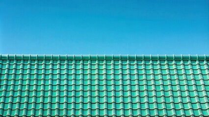 Poster - A symmetrical roof with a patterned design of green tiles against a blue sky.