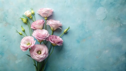 Poster - Delicate Pastel Flowers Arranged on a Soft Blue Background with Copy Space
