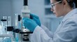 © Konstiantyn Zapylaie - Female scientist examining samples with microscope in laboratory setting