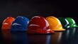 © akun - Colorful hard hats in a row.