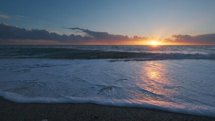Wall Mural - sunset over sea with vibrant colors