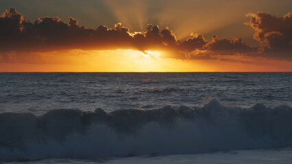 Wall Mural - sunset over sea waves with vibrant colors