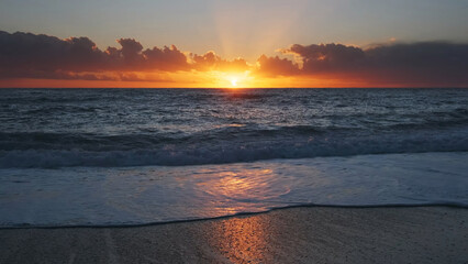 Wall Mural - sunset over sea with vibrant colors