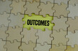 © Ardini - Close up of the last jigsaw puzzle piece with word outcomes