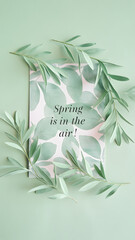 Wall Mural - Pastel green background with the word 'Spring' in pink cursive surrounded by delicate green leaves.