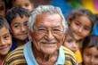 © Michael - Portrait of a cheerful latin senior man smiling with a group of children in the background
