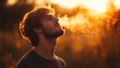 © mahamad - Attractive man breathing in outdoor air.