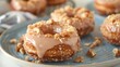 © Anna - Glazed Donuts with Crunchy Nut Topping on Marble Background