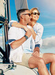 © peopleimages.com - Sea, hug or happy couple on boat for holiday, travel or vacation with love or adventure in Greece. Embrace, summer or mature people on yacht at beach to relax for ocean, honeymoon trip or anniversary