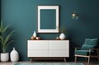 © DARPANA - minimalist commode with decor in living room interior, Dark Teal wall background, blank poster frame