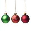 © Fragton - Three hanging Christmas ornaments; green, red patterned, and dark red.