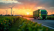 © Pete - Green truck transports cargo on highway at sunset. Renewable energy source wind turbines visible in background. Eco-friendly transportation concept shown. Sustainable logistics, supply chain