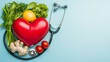 © Eman Suardi - A heart symbol surrounded by healthy foods and a stethoscope, promoting heart health.