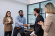 © Verin - business men doing hands shake for the future business cooperation,multiracial business partnership meeting in the office room